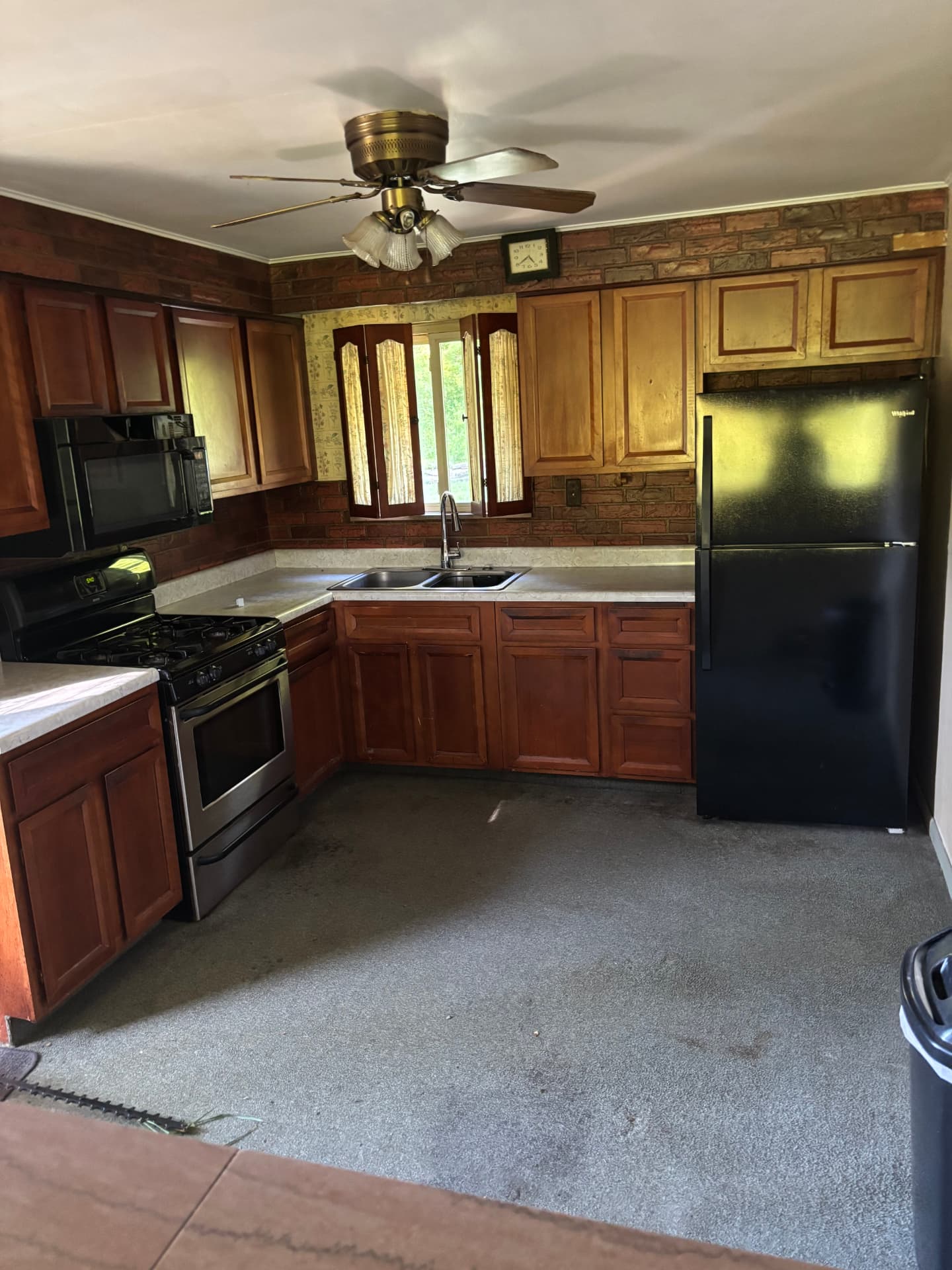 Chris's kitchen before the remodel — dated walls and old flooring